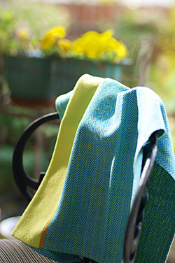 Sunshine on my Shoulders kitchen towel draped on a chiar